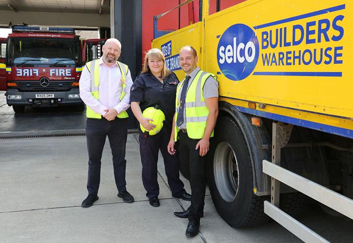 Selco branch managers Darryl Munday and Paul Brady with Bexley Heath firefighter Rebecca Selwood