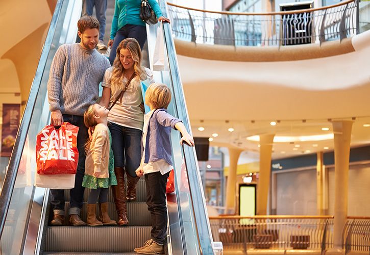 monkeybusinessimages family shoppers shoping centre escalator iStock-496648303