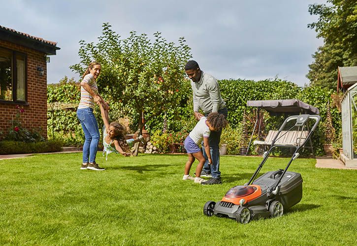 Happy Family with Flymo Lawnmower