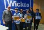 Wickes COO Fraser Longden, CMO Gary Kibble, CPO Sonia Astill with winners and runners up