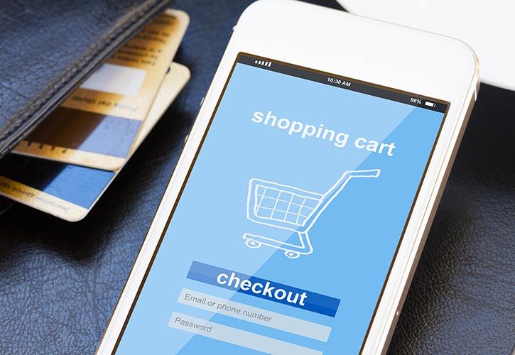 Mobile with shopping trolley and bank cards shutterstock_265411373 725 x 500.jpg