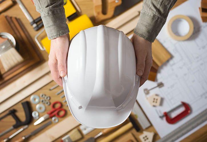 Hard hat and DIY construction tools shutterstock_273322682 725 x 500.jpg